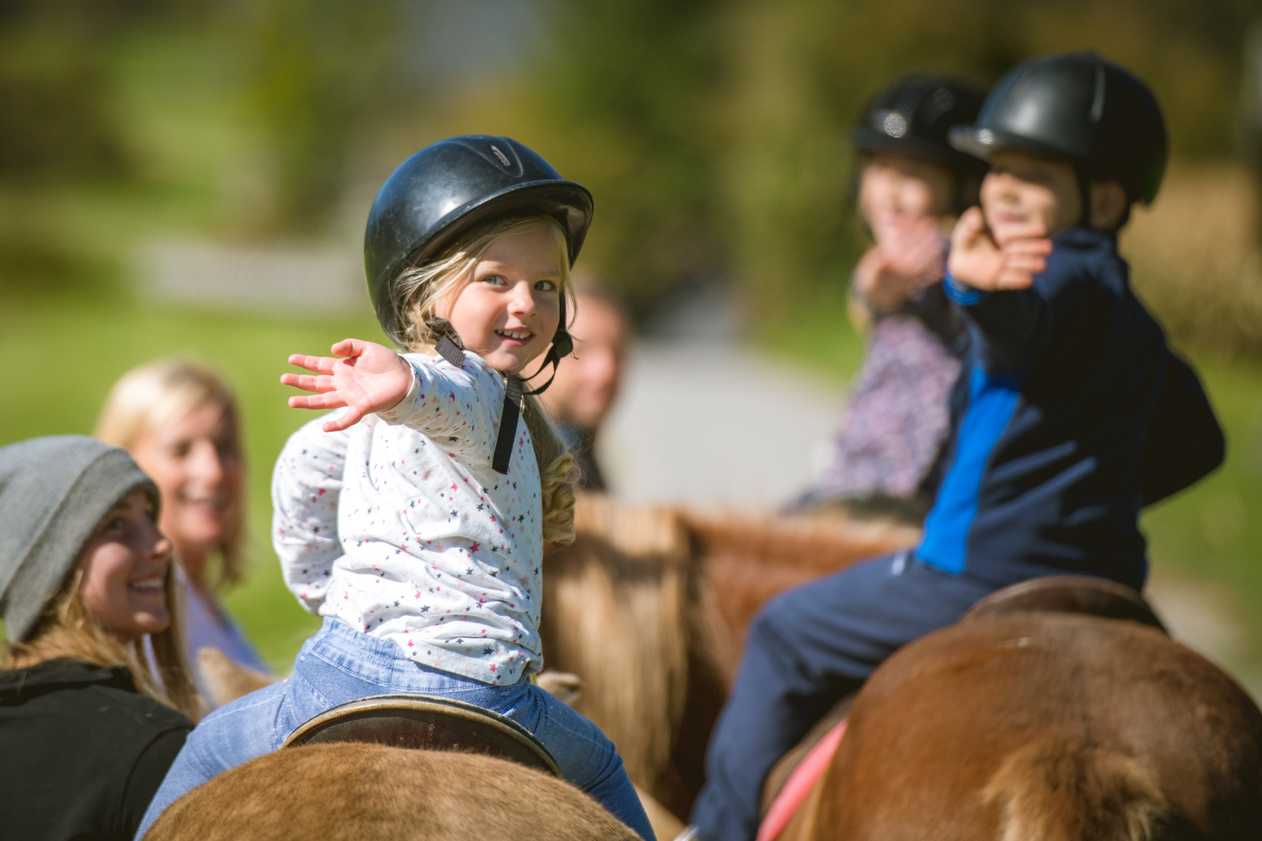 Children training horseback riding